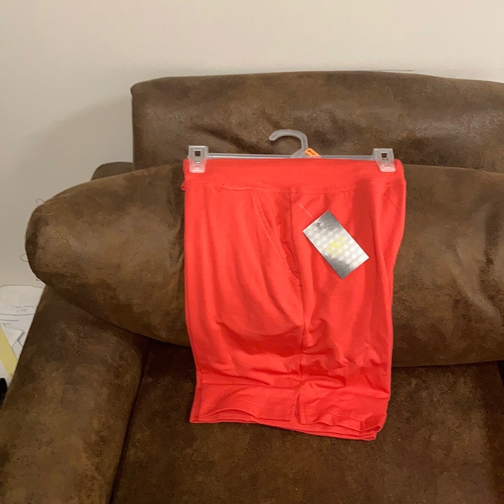 3/$30 BNWT. Orange workout shorts outfit.